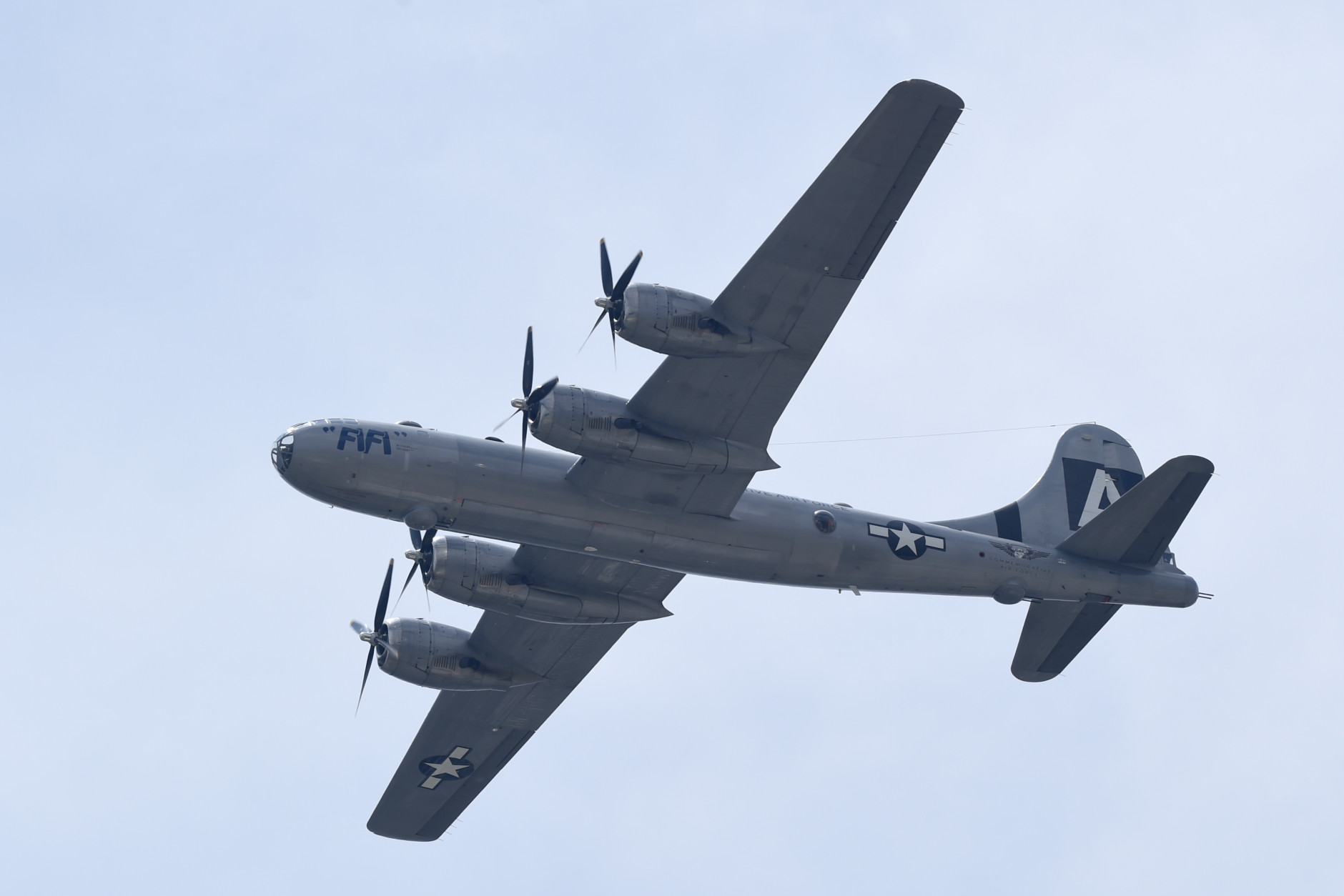 The B-29 Superfortress named "Fifi" and the plane that dropped the atomic bomb, flies over the skies of Washington, Friday, May 8, 2015. Dozens of vintage military aircraft from World War II made the flight over the nation's capital to mark the 70th anniversary of Victory in Europe Day. (AP Photo/Susan Walsh)