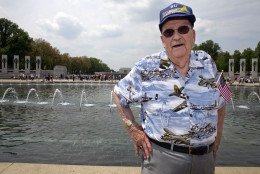 WWII Veteran Bill Hare, 89, of Stewartstown, Pa., poses for a portrait while wearing a hat and shirt emblazoned with B-17's after attending a ceremony at the World War II Memorial in Washington, Friday, May 8, 2015, where WWII era aircraft flew over the memorial and the National Mall in honor of the 70th anniversary of Victory in Europe Day (VE Day), during the Arsenal of Democracy: World War II Victory Capitol Flyover.  The Flyover above the National Mall featured historically sequenced formations of more than 50 vintage World War II aircraft. Hare was an engineer who flew on B-17's during the war, and says he enjoyed being in the military. (AP Photo/Jacquelyn Martin)