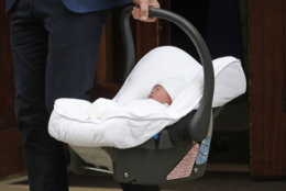 Britain's Prince William carries his newborn baby son as he leaves the Lindo wing at St Mary's Hospital in London London, Monday, April 23, 2018. The Duchess of Cambridge gave birth Monday to a healthy baby boy — a third child for Kate and Prince William and fifth in line to the British throne. (AP Photo/Frank Augstein)