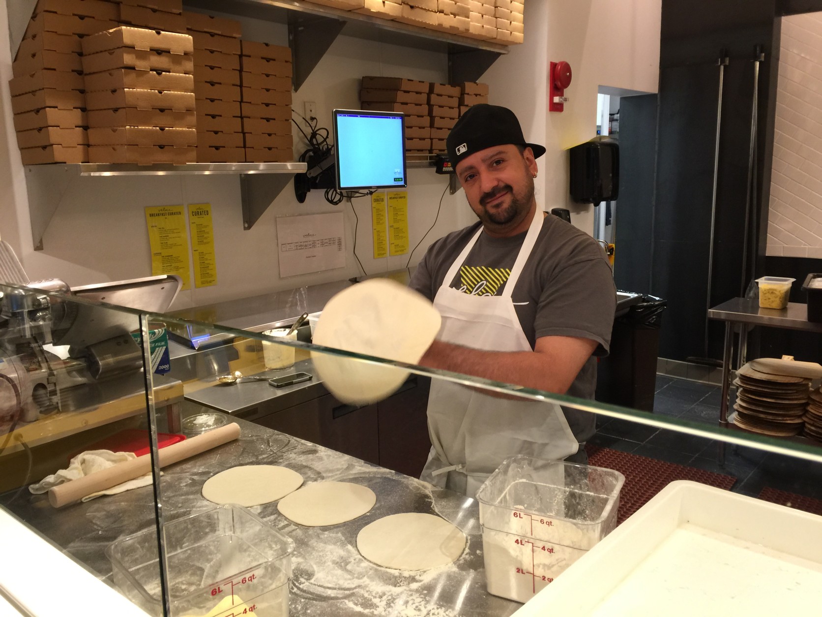 Daniel Salamanca gets dough ready at Veloce. (WTOP/Kristi King)
