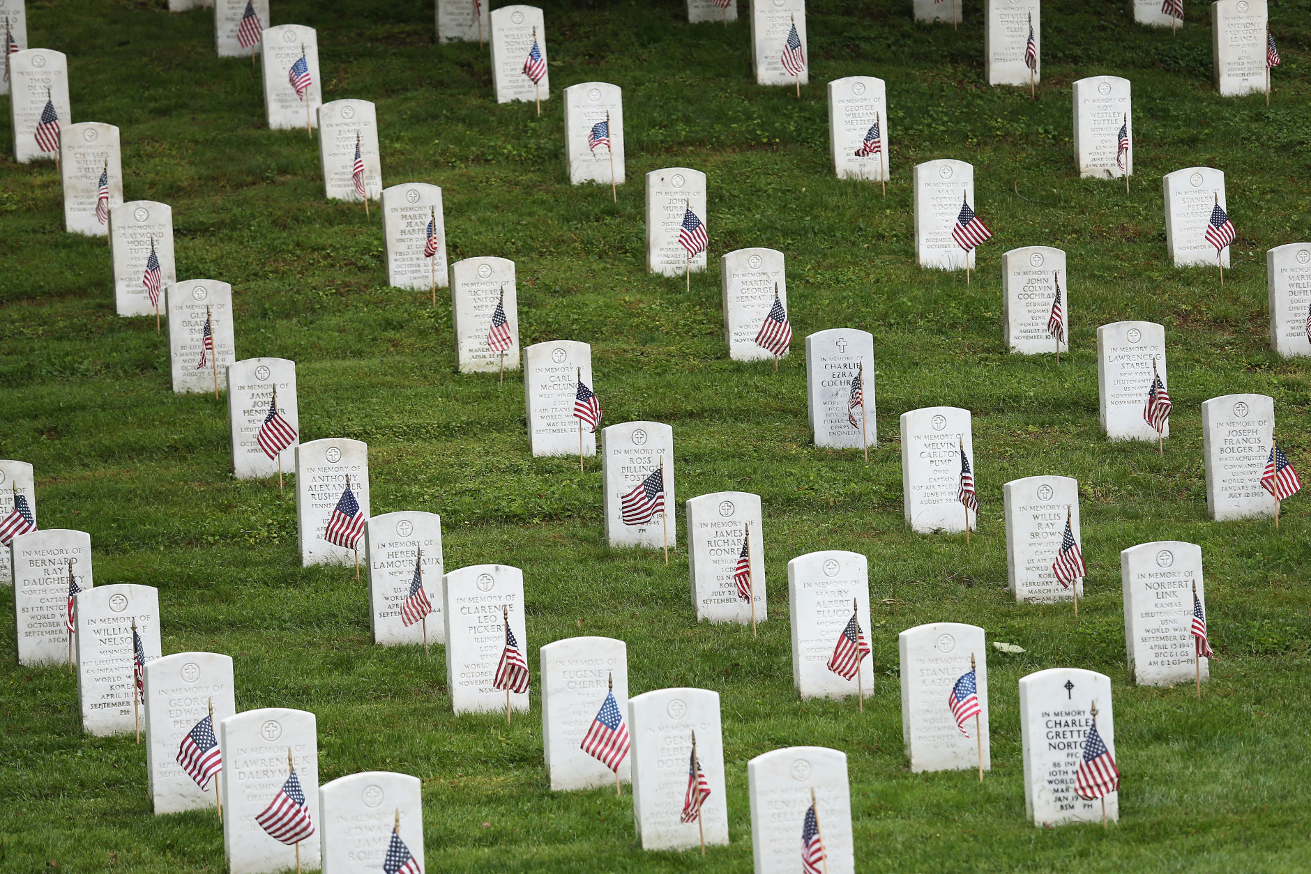 ARLINGTON, VA - MAY 21:  American flags placed by members of the 3rd U.S. Infantry Regiment at the graves of U.S. soldiers buried at Arlington National Cemetery in preparation for Memorial Day are seen May 21, 2015 in Arlington, Virginia. 'Flags-In' has become an annual ceremony since the 3rd U.S. Infantry Regiment (The Old Guard) was designated to be an Army's official ceremonial unit in 1948.  (Photo by Win McNamee/Getty Images)