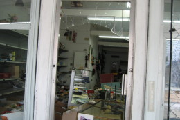 Looters broke the windows to get into J-mart Wigs. (Courtesy Matthew Chung)