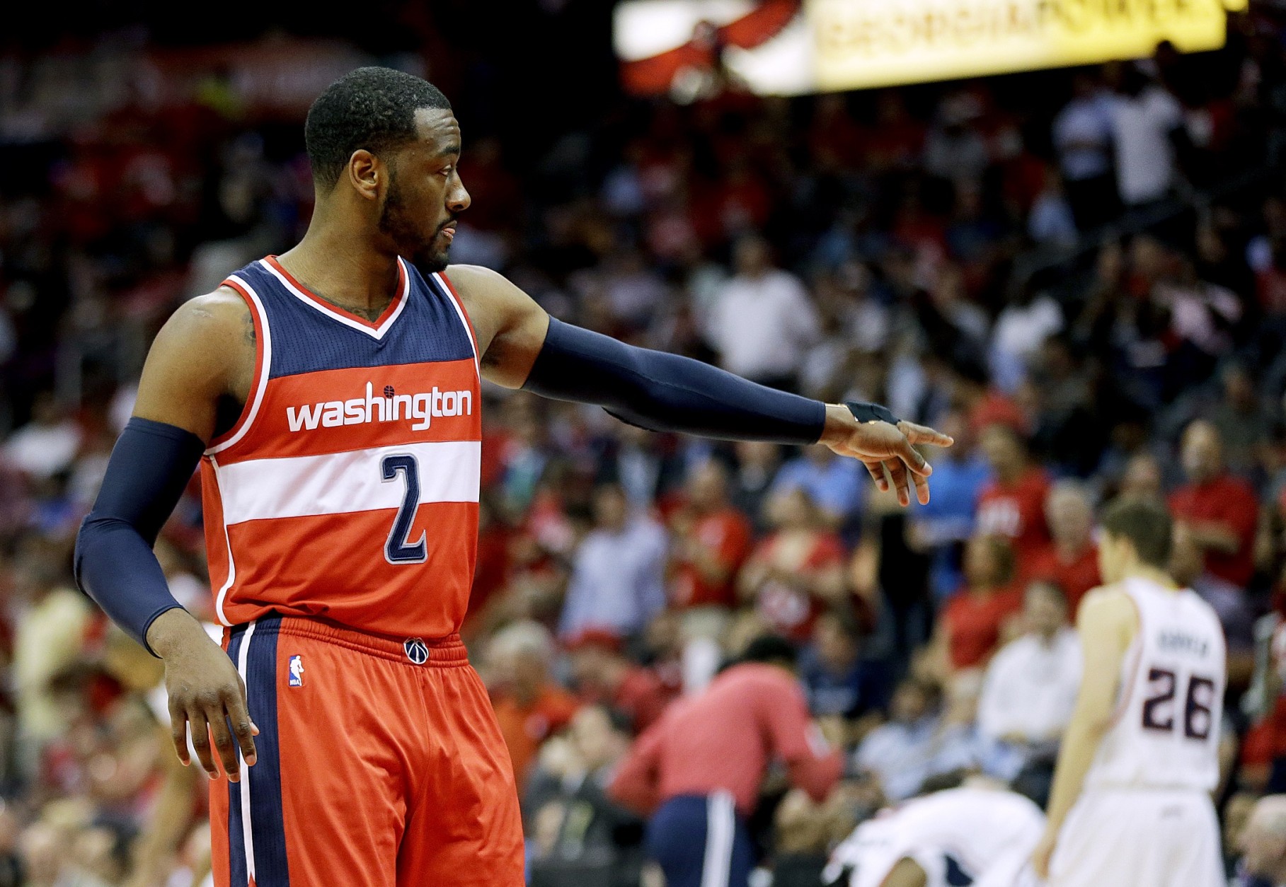 Washington Wizards' John Wall walks on the court during the first quarter of Game 5 of the second round of the NBA basketball playoffs against the Atlanta Hawks Wednesday, May 13, 2015, in Atlanta. (AP Photo/John Bazemore)