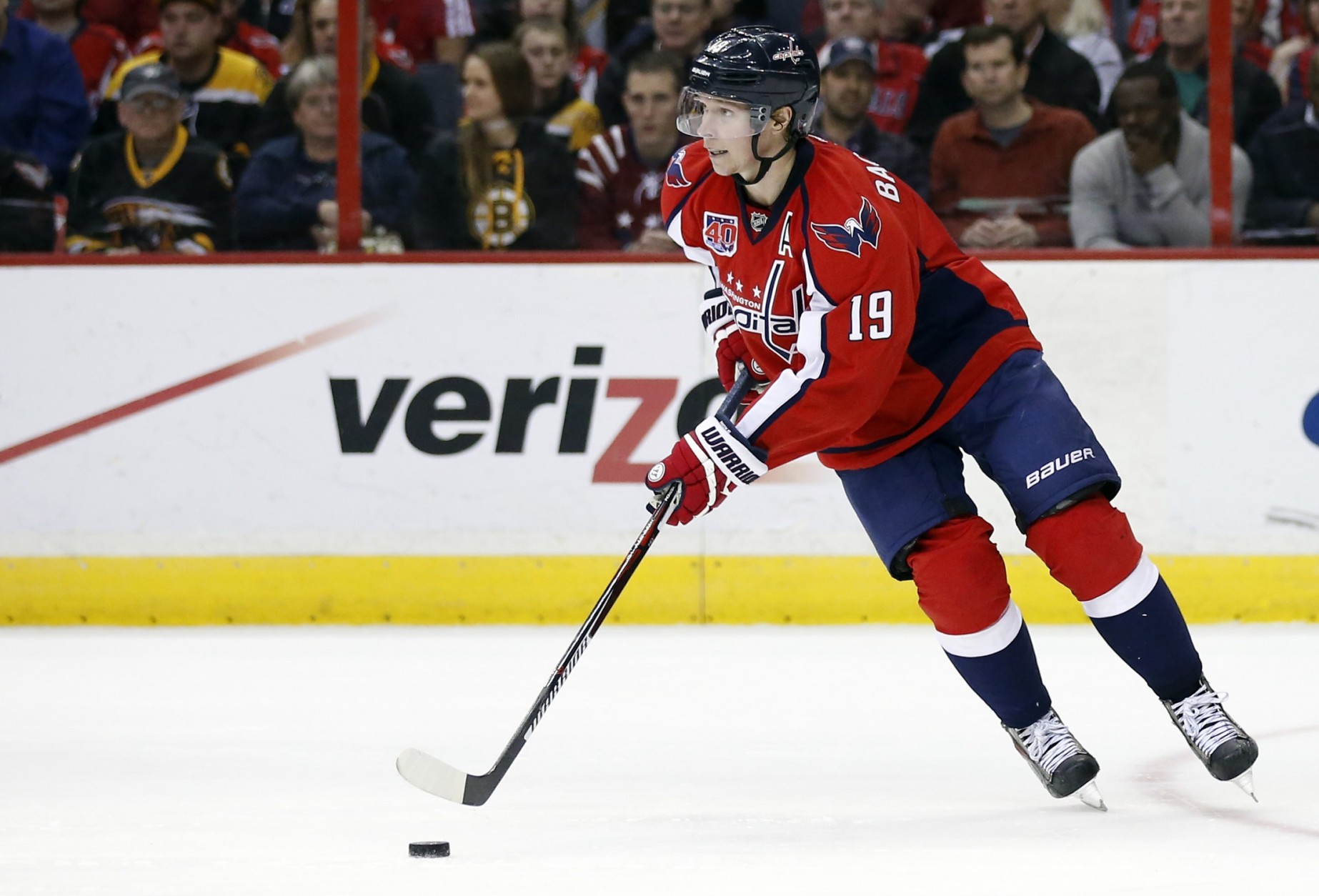 Washington Capitals center Nicklas Backstrom (19), from Sweden, looks to pass the puck in the second period of an NHL hockey game against the Boston Bruins, Sunday, March 15, 2015, in Washington. (AP Photo/Alex Brandon)