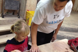 A young student learns with clay. (Leslie Mansour/CHAW)