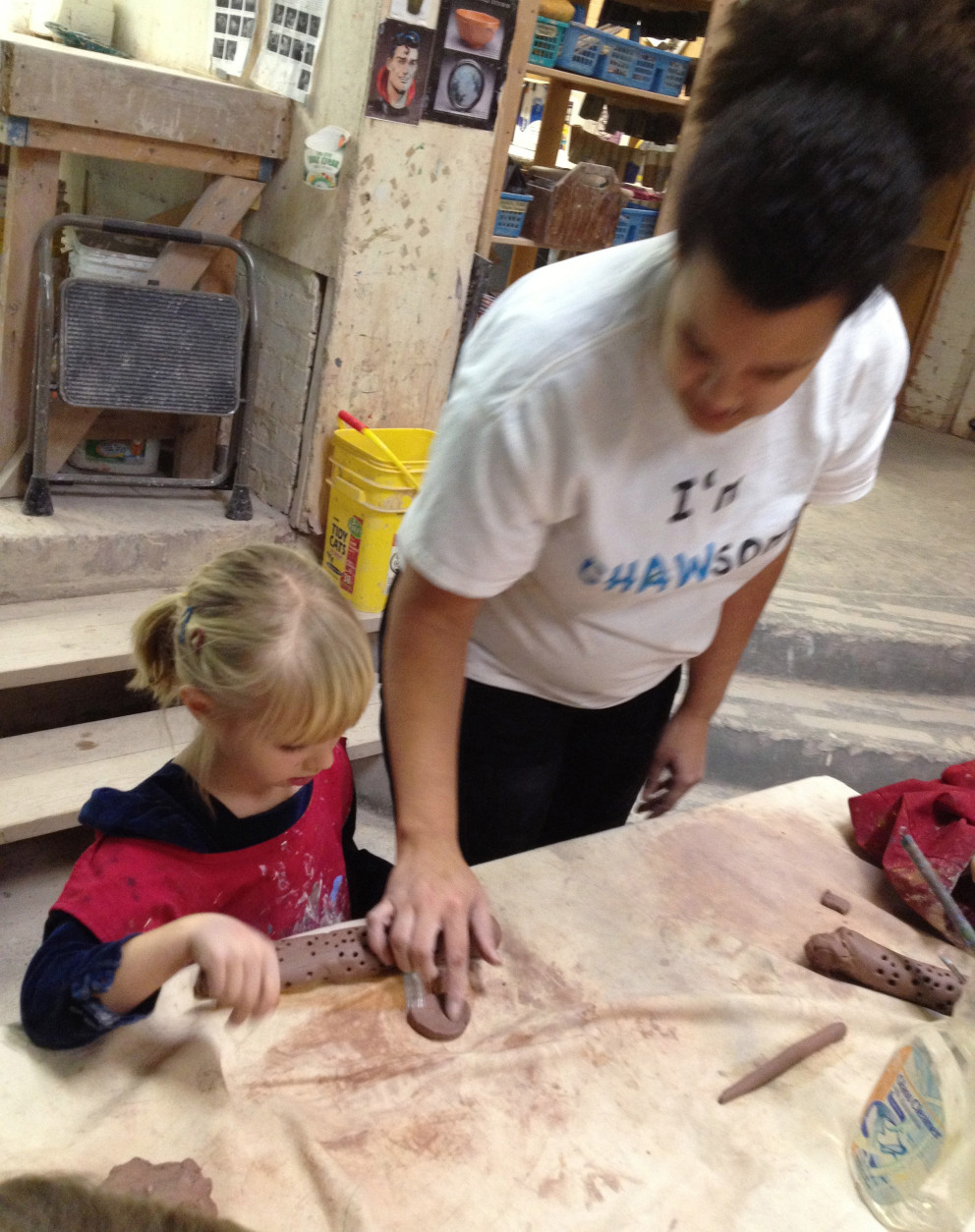 A young student learns with clay. (Leslie Mansour/CHAW)