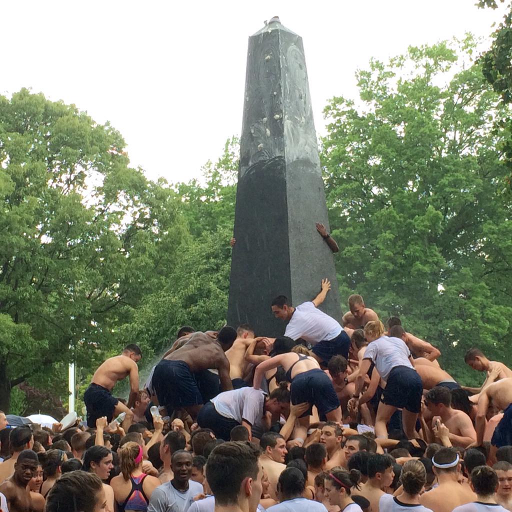 Naval Academy plebes brave humidity, rain in monument climb