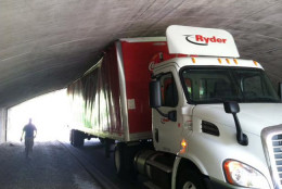 A Coca-Cola truck became wedged beneath the Memorial Bridge Tuesday afternoon. Commercial trucks are not allowed to travel along the George Washington Memorial Parkway without a permit. (WTOP/Dave Dildine)