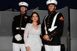 WASHINGTON, DC - MAY 23: Singer-songwriter Gloria Estefan poses for a photo with Marines at the 26th National Memorial Day Concert Rehearsals on May 23, 2015 in Washington, DC. (Photo by Paul Morigi/Getty Images for Capitol Concerts