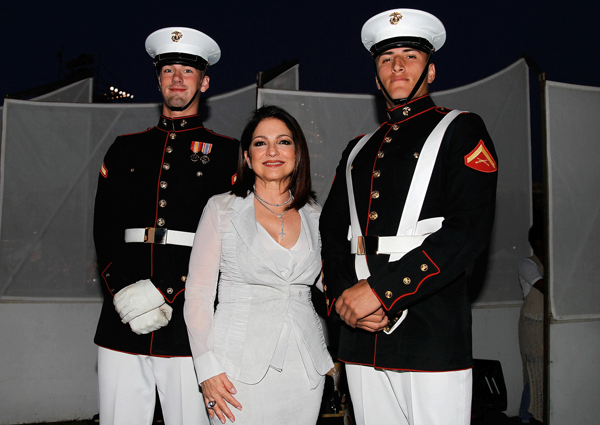 WASHINGTON, DC - MAY 23: Singer-songwriter Gloria Estefan poses for a photo with Marines at the 26th National Memorial Day Concert Rehearsals on May 23, 2015 in Washington, DC. (Photo by Paul Morigi/Getty Images for Capitol Concerts