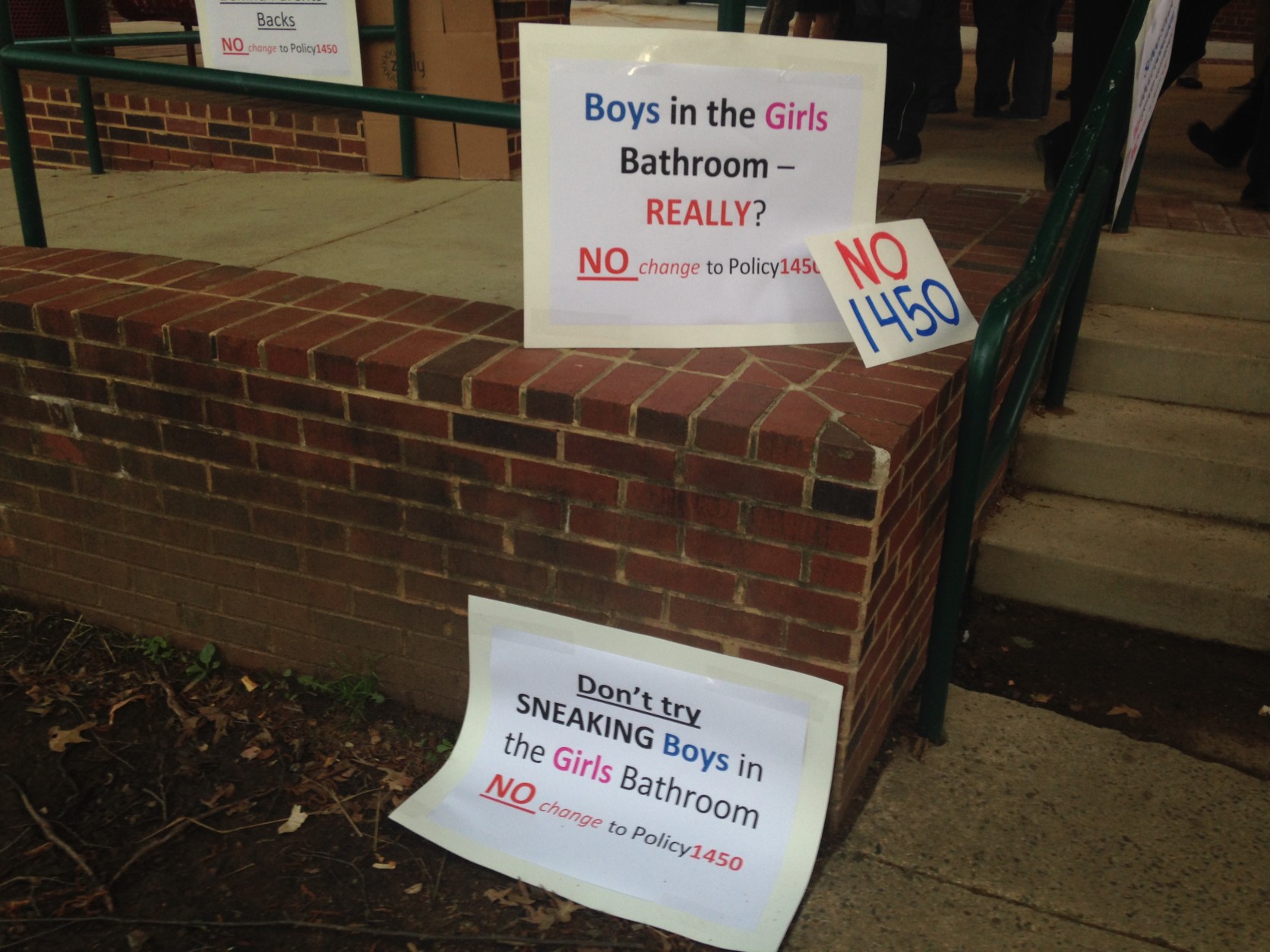 Signs seen outside the Fairfax County School Board meeting Thursday, May 7, 2015. (WTOP/Michelle Basch)
