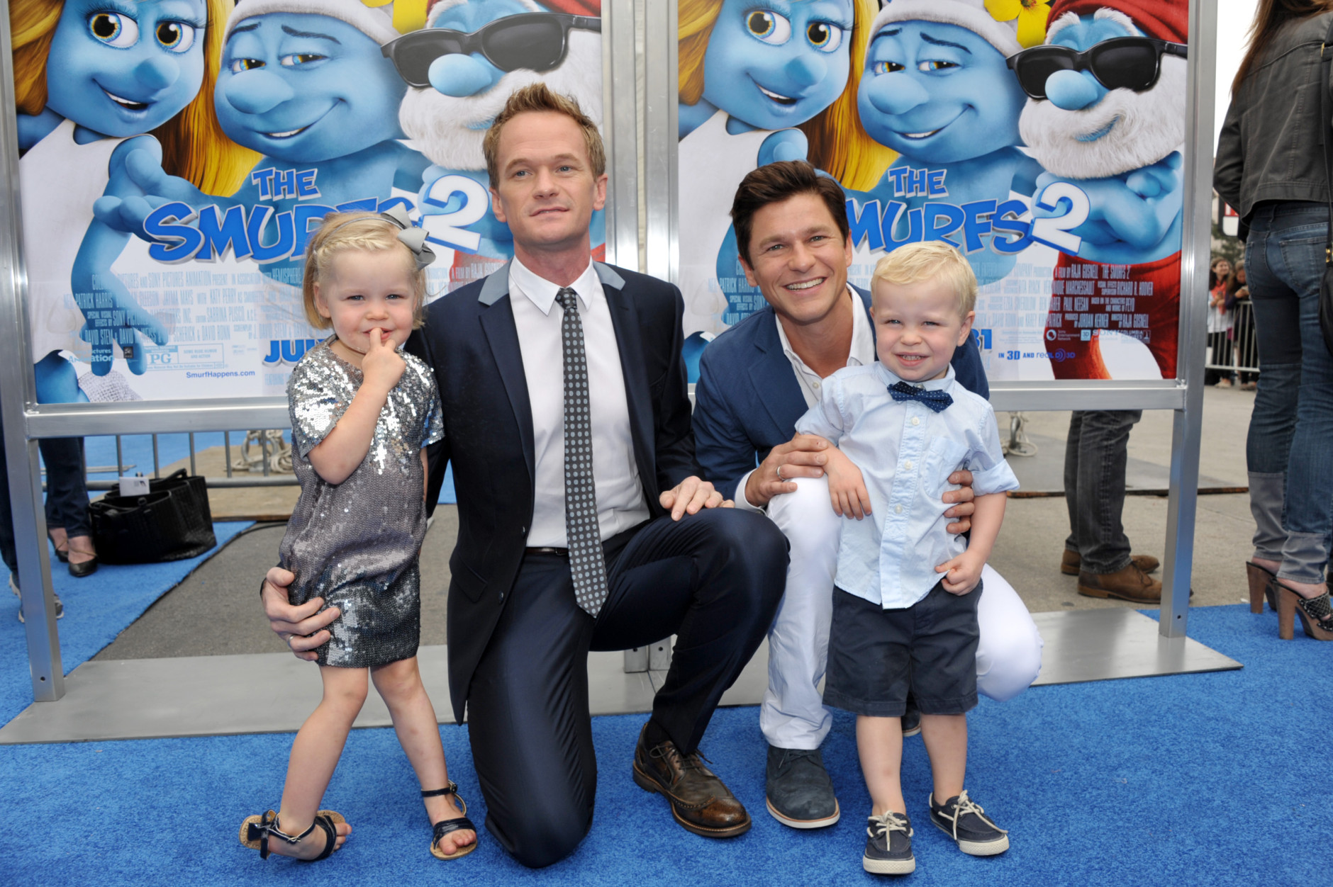 Neil Patrick Harris and David Burtka with twins Harper Grace Burtka-Harris, left, and Gideon Scott Burtka-Harris, right, arrive to the world premiere of &quot;The Smurfs 2&quot; at the Regency Village Theatre on Sunday, July 28, 2013 in Los Angeles. (Photo by John Shearer/Invision/AP)