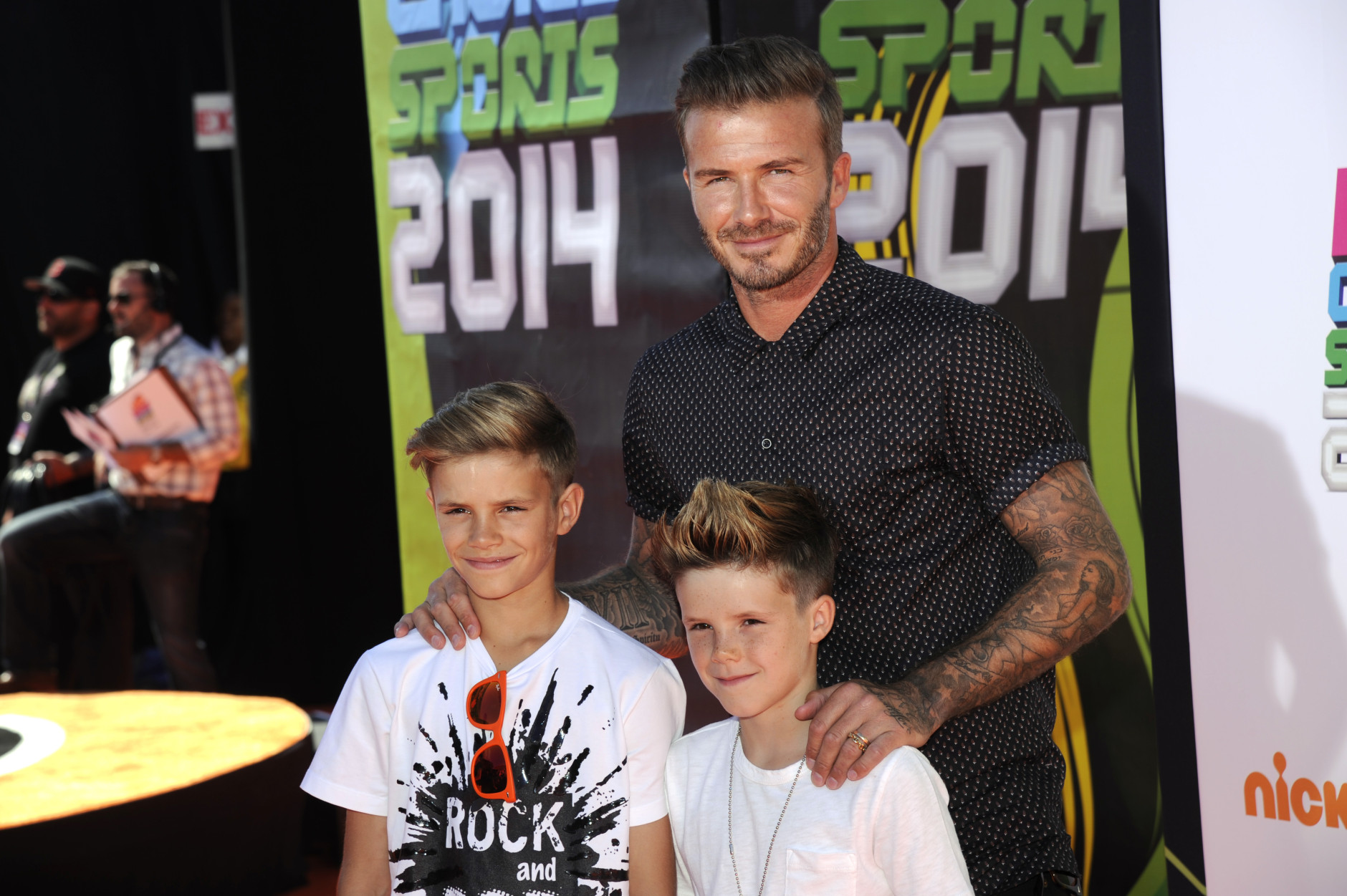 David Beckham, right, and his sons, from left, Romeo James Beckham and Cruz David Beckham arrive at the Kids' Choice Sports Awards at UCLA's Pauley Pavilion on Thursday, July 17, 2014, in Los Angeles. (Photo by Chris Pizzello/Invision/AP)