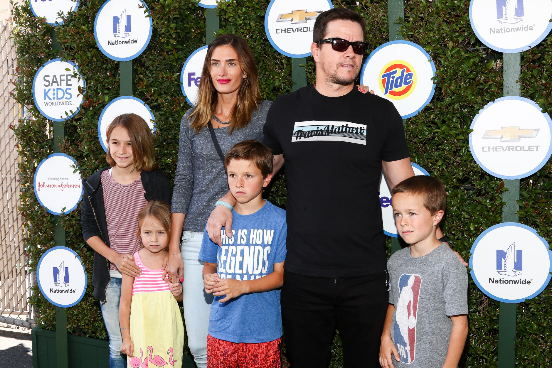 Rhea Durham, from left to right,  Mark Wahlberg and kids attends Safe Kids Day LA Event at The Lot on Sunday, April 26, 2015 in West Hollywood, Calif. (Photo by John Salangsang/Invision/AP)