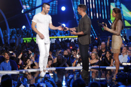 Cassadee Pope, from right, and Nick Fradiani present the award for breakthrough video of the year to Sam Hunt for "Leave the Night On" at the CMT Music Awards at Bridgestone Arena on Wednesday, June 10, 2015, in Nashville, Tenn. (Photo by Wade Payne/Invision/AP)