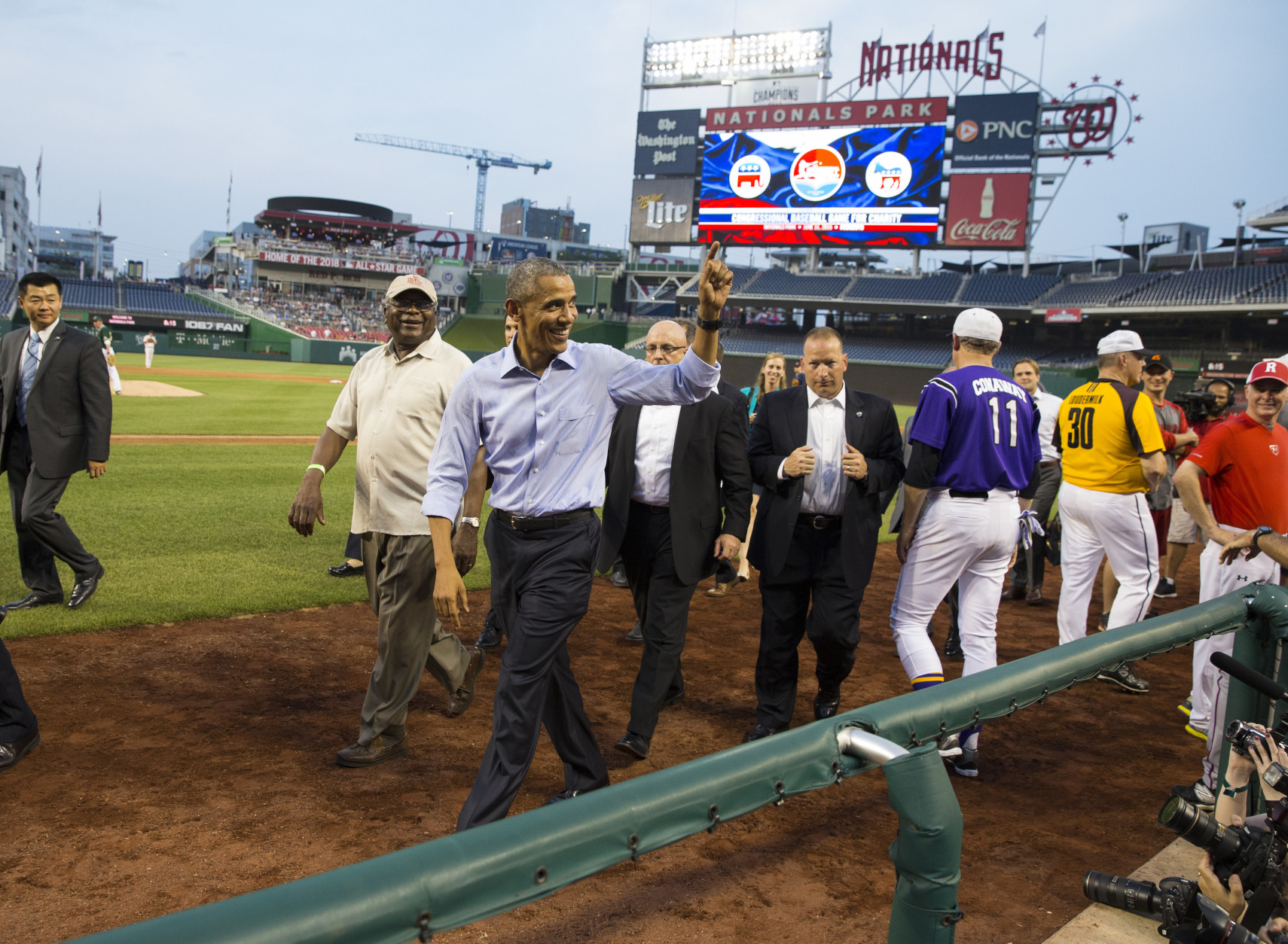 President Barack Obama smiles as he makes a visit to the Congressional baseball game at Nationals Park, on Thursday, June 11, 2015, in Washington (AP Photo/Evan Vucci)