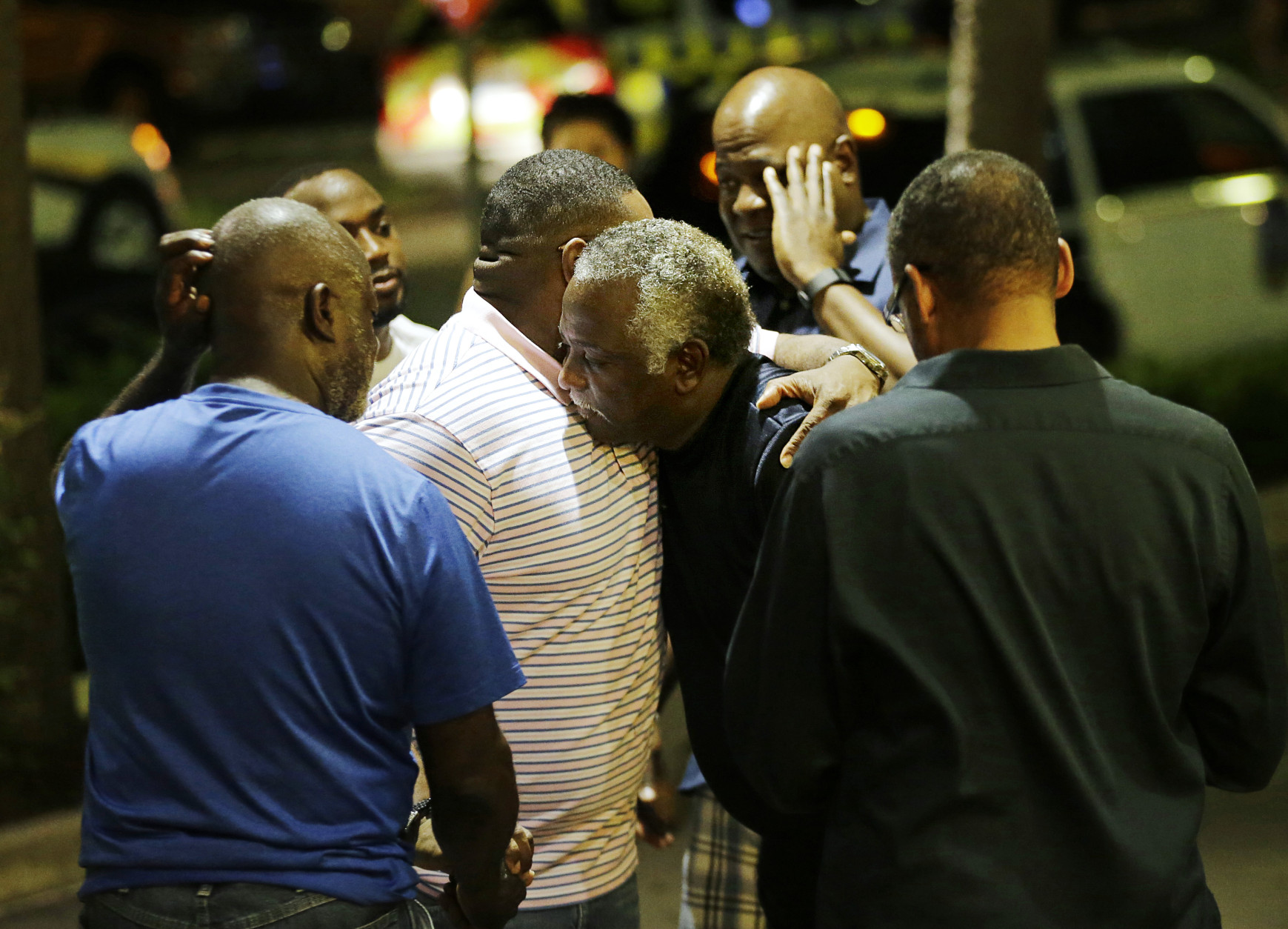 Worshippers embrace following a group prayer across the street from the Emanuel AME Church following a shooting Wednesday, June 17, 2015, in Charleston, S.C. (AP Photo/David Goldman)