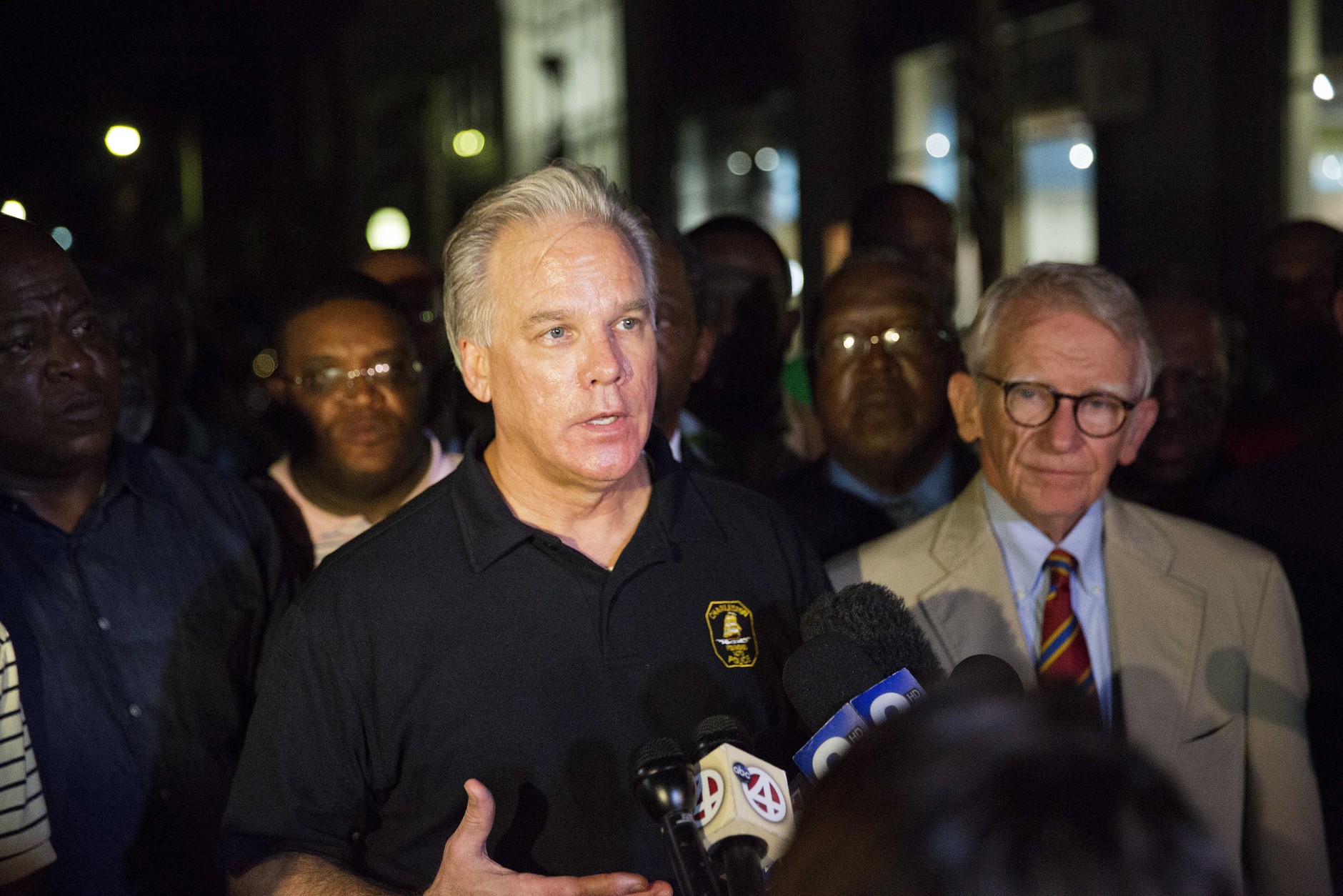 Charleston Police Chief Gregory Mullen, center, addresses the media while joined by Mayor Joseph Riley, right, down the street from the Emanuel AME Church early Thursday, June 18, 2015 following a shooting Wednesday night in Charleston, S.C. (AP Photo/David Goldman)