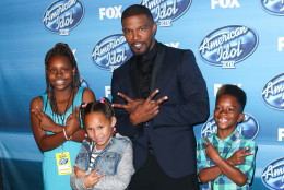 Jamie Foxx, left, and kids pose in the press room at the American Idol XIV finale at the Dolby Theatre on Wednesday, May 13, 2015, in Los Angeles. (Photo by John Salangsang/Invision/AP)