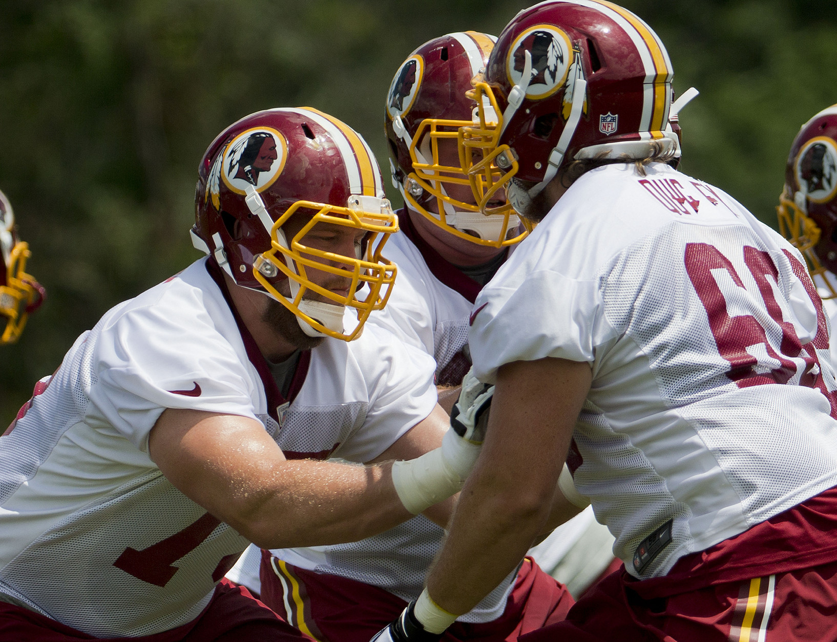 Washington Redskins Brandon Scherff, left, and Bryce Quigley, right, take part in drills during NFL football minicamp at Redskins Park Tuesday, June 16, 2015 in Ashburn, Va. (AP Photo/Pablo Martinez Monsivais)
