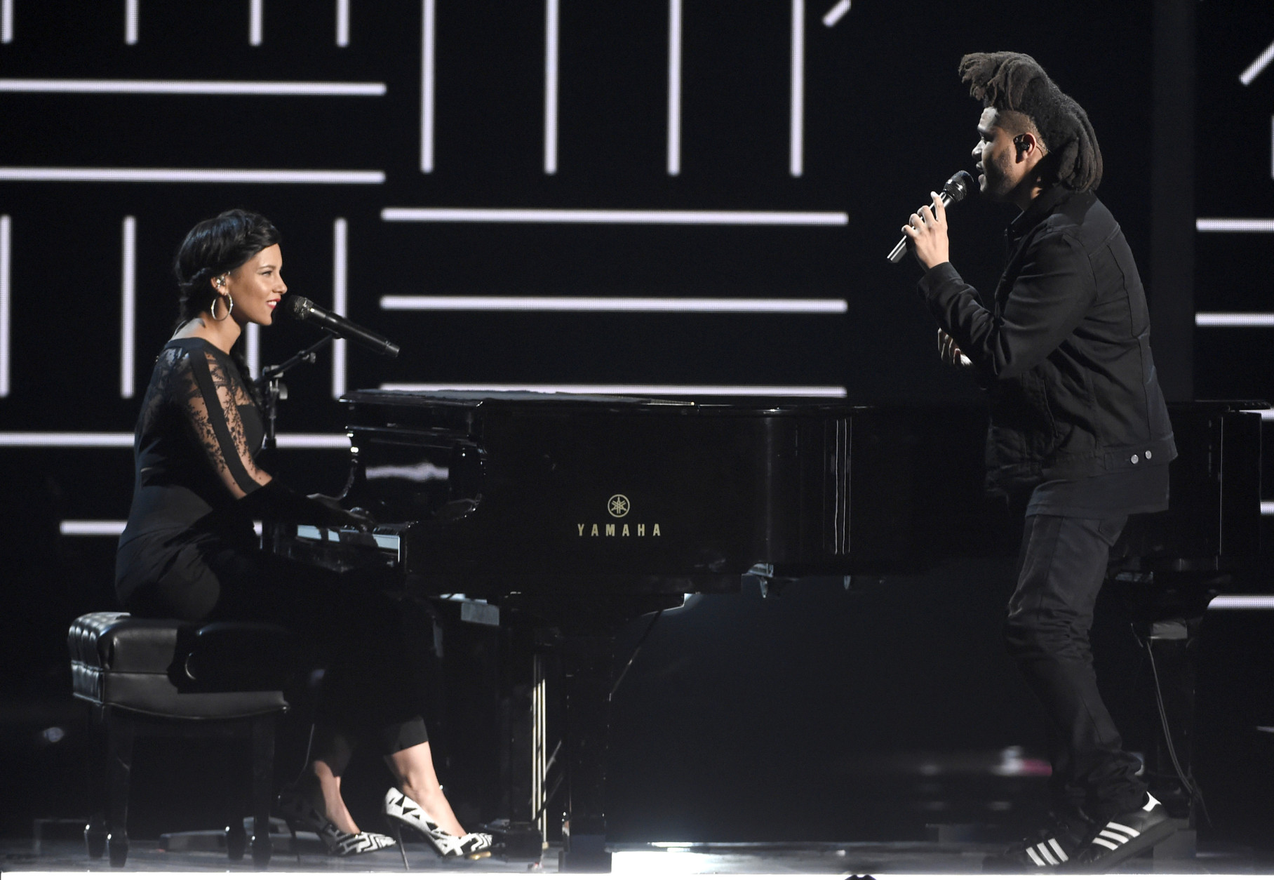 Alicia Keys, left, and The Weeknd perform at the BET Awards at the Microsoft Theater on Sunday, June 28, 2015, in Los Angeles. (Photo by Chris Pizzello/Invision/AP)