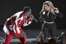 Sean "Diddy" Combs, left, and Lil' Kim perform at the BET Awards at the Microsoft Theater on Sunday, June 28, 2015, in Los Angeles. (Photo by Chris Pizzello/Invision/AP)