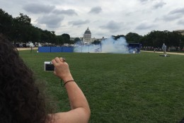 A CPSC demonstration of dangerous firework use created great interest on the National Mall June 26, 2015. (WTOP/Kristi King)