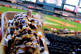 After all those savory dogs, time for a sweat break. The Arizona Diamondbacks offer the churro dog. The "bun" is really a chocolate-drizzled "long-john" doughnut. It holds a cinnamon churro topped with yogurt and whipped cream then more drizzled chocolate plus caramel sauces. Hot Dog Explorer ranking: 29. (Courtesy Tom Lohr)