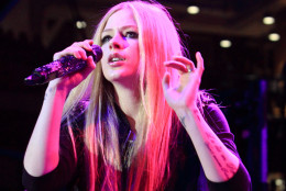 FILE -In this Dec. 13, 2013, file photo, Avril Lavigne performs in concert during the Mix 106.5 Mistletoe Meltdown at SECU Arena Towson University in Towson, Md. Organizers of the Special Olympics World Games announced Thursday, June 18, 2015, that Stevie Wonder, Cody Simpson, Lavigne and several other stars will perform during the games’ opening ceremonies in Los Angeles on Saturday, July 25. The event, held every four years, will feature 7,000 athletes and tens of thousands of spectators from around the world. (Photo by Owen Sweeney/Invision/AP, File)