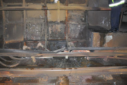 This handout photo provided by the National Transportation Safety Board (NTSB) shows damage from the arcing incident in the tunnel near L'Enfant Plaza Metro Station in Washington. Investigators say an electrical malfunction that filled a Washington subway train with smoke continued for 44 minutes before the Metro transit agency shut off power to the affected rail. The NTSB released a preliminary report on the accident Friday. One woman was killed and more than 80 people were sickened by smoke when the train stopped in a tunnel near the L'Enfant Plaza station Monday afternoon. (AP Photo/NTSB)
