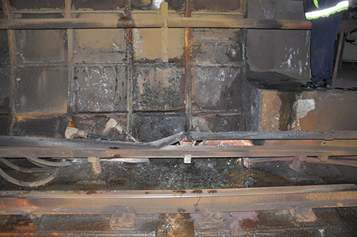 This handout photo provided by the National Transportation Safety Board (NTSB) shows damage from the arcing incident in the tunnel near L'Enfant Plaza Metro Station in Washington. Investigators say an electrical malfunction that filled a Washington subway train with smoke continued for 44 minutes before the Metro transit agency shut off power to the affected rail. The NTSB released a preliminary report on the accident Friday. One woman was killed and more than 80 people were sickened by smoke when the train stopped in a tunnel near the L'Enfant Plaza station Monday afternoon. (AP Photo/NTSB)