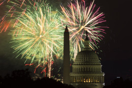 Fireworks illuminate the sky over the U.S. Capitol building and the Washington Monument during Fourth of July celebrations, on Friday, July 4, 2014, in Washington. (AP Photo/Evan Vucci)
