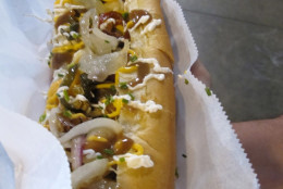 Of course Milwaukee's dog is really a brat. Called the Downtown Wisconsin Avenue Brat, a euphemism for home plate, this animal features an 18-inch-long spicy brat . The brat is topped with beef gravy, shoe string fries, "frizzled" sauerkraut, cheese curds, cheese sauce, sour cream and more. Mix all that together for a perfect 30 on the Hot Dog Explorer scale. (Courtesy Tom Lohr)