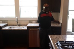 Kitchen has a sink and other areas that can be automatically raised and lowered. It allows Porta to use the areas if he is ever in a wheelchair. His wife, who is no taller than 5 feet, jokes that everything is her size. (WTOP/Max Smith)