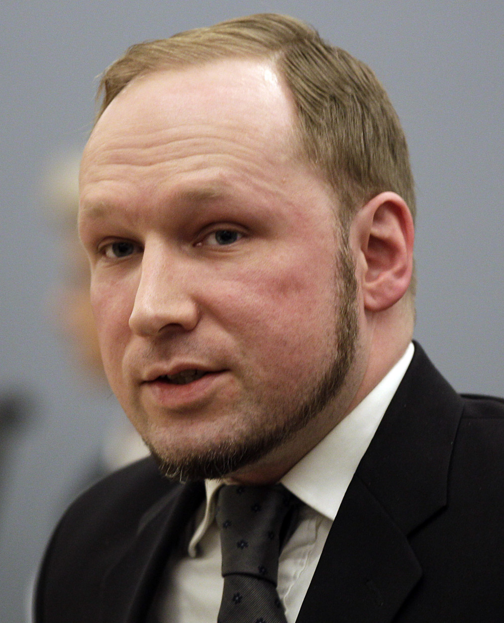On this date in 2011, Anders Breivik massacred 69 people at a Norwegian island youth retreat after detonating a bomb in nearby Oslo that killed eight others. Here, Breivik  is seen in a courtroom after his trial on Aug. 24, 2012. (AP Photo/Frank Augstein)