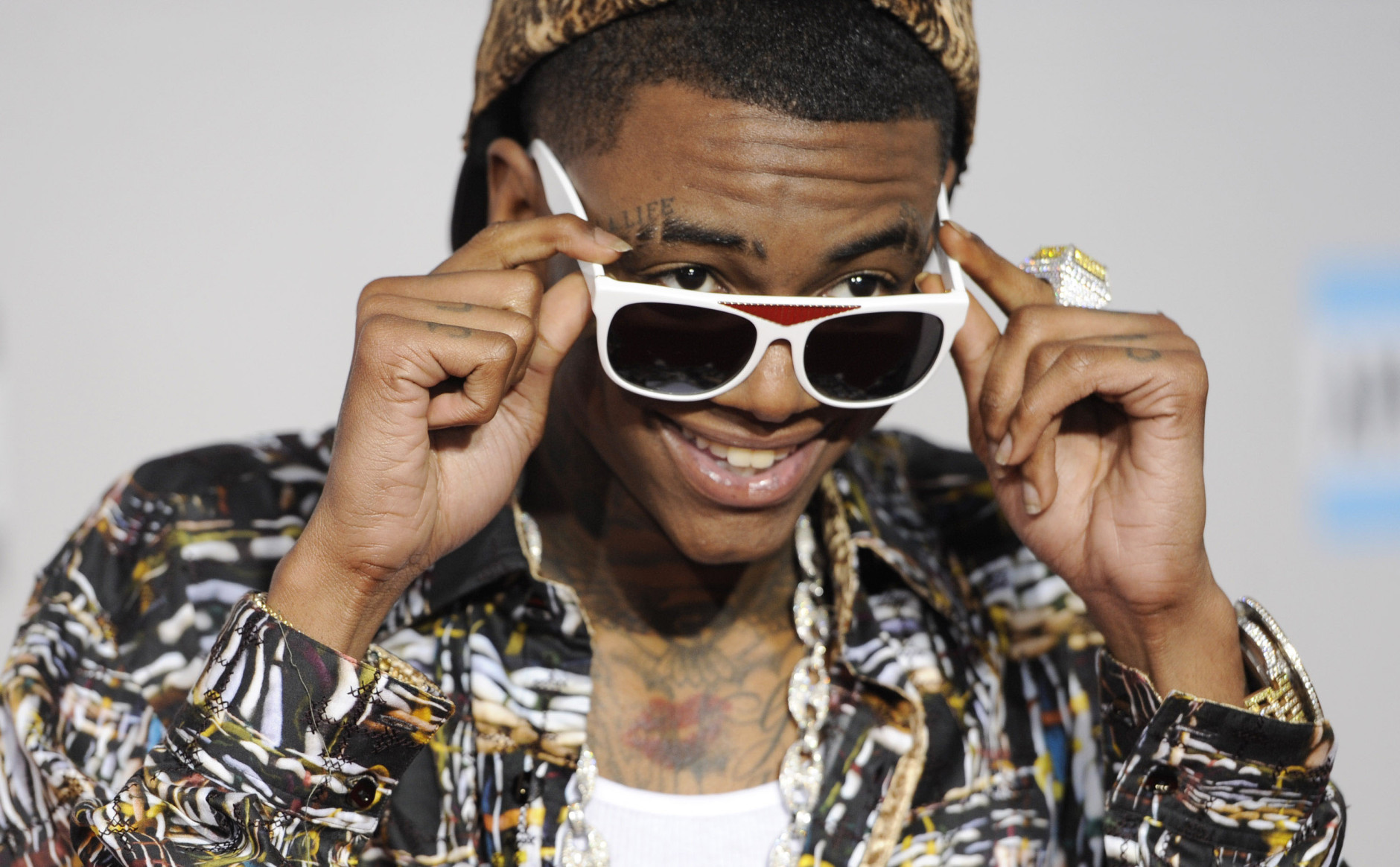 Rapper Soulja Boy is 25 on July 28, 2015. Here, Soulja Boy arrives at the 39th Annual American Music Awards on Sunday, Nov. 20, 2011 in Los Angeles. (AP Photo/Chris Pizzello)