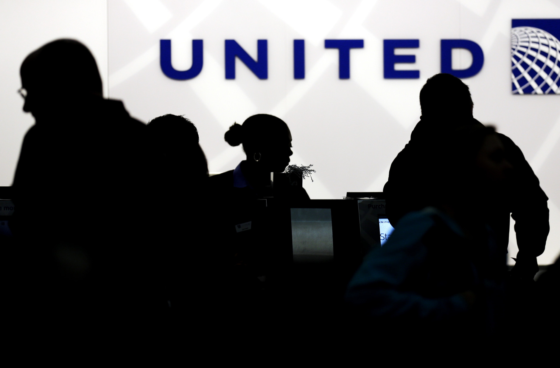 FILE - In this Saturday, Dec. 21, 2013, file photo, travelers check in at the United Airlines ticket counter at Terminal 1 in O'Hare International Airport in Chicago. Starting March 2015, elite members of Uniteds MileagePlus will earn between 7 and 11 miles for every dollar they spend on tickets, not counting taxes. Regular members, those who fly less than 25,000 miles and spend less than $2,500 a year, will get 5 miles per dollar toward free travel. (AP Photo/Nam Y. Huh, File)