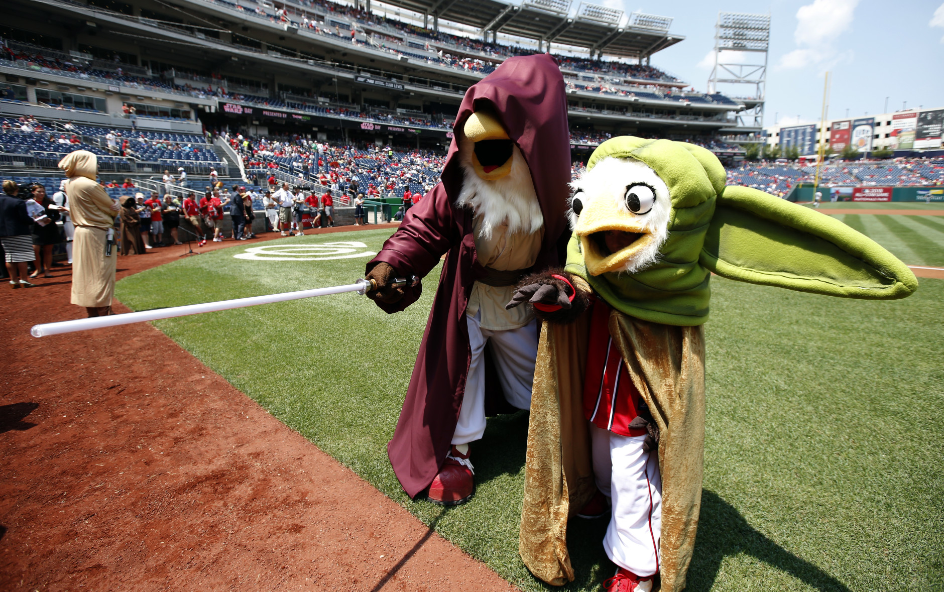 Washington Nationals mascots Screech and Little Screech wear Star Wards costumes as Luke Skywalker and Yoda, on Star Wars day before a baseball game against the Los Angeles Dodgers at Nationals Park, Sunday, July 19, 2015, in Washington. (AP Photo/Alex Brandon)