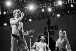 David Bowie performs on stage at London's Wembley Stadium during the Live Aid famine relief rock concert, July 13, 1985. (AP Photo/Joe Schaber)