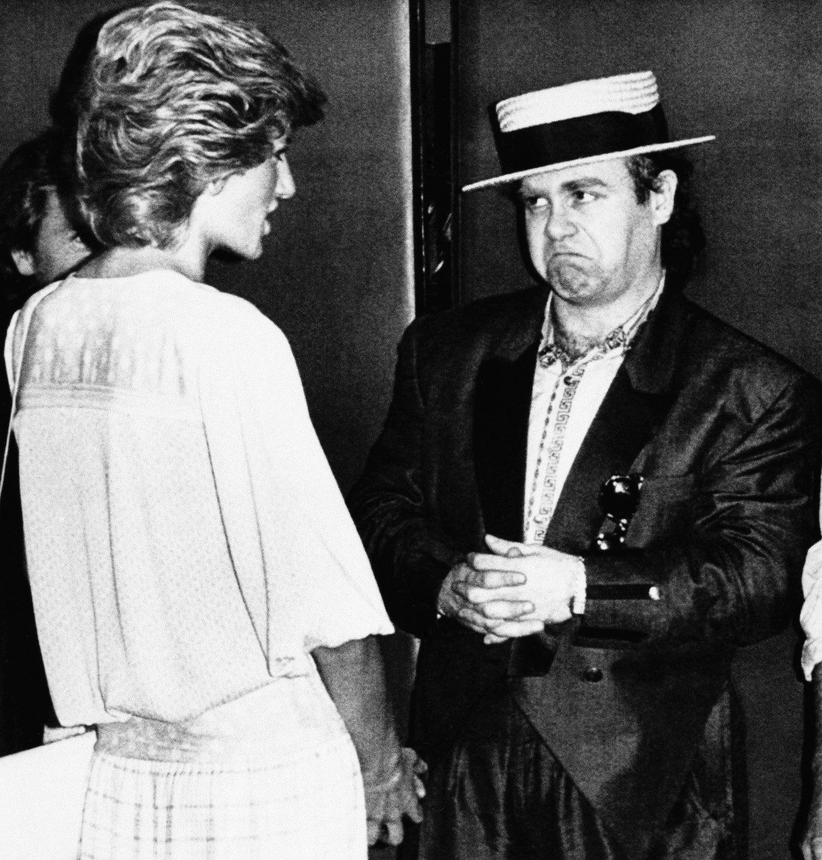 Britains Diana, Princess of Wales, left, meets rock star Elton John on her arrival at Wembley Stadium for the London end of the Live Aid famine relief concert for Africa, which was being relayed by TV to the world from there and Philadelphia, July 13, 1985, London, England. (AP Photo/Rota/Pool)