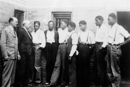 Just after he asked the Governor of Alabama to pardon the nine youths held in the Scottsboro case, Samuel Leibowitz, New York attorney, conferred with seven of the defendants, May 1, 1935, at the Scottsboro jail.  Left to right are:  Deputy Sheriff Charles McComb, Leibowitz, and the defendants, Roy Wright, Olen Montgomery, Ozie Powell, Willie Robertson, Eugene Williams, Charlie Weems, and Andy Wright.  The youths were charged with an attack on two white women on March 25, 1931.  (AP Photo)