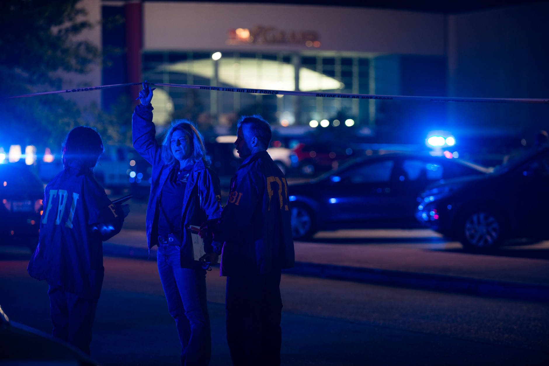 Federal investigators respond to the scene of a shooting at the Grand Theatre on Thursday, July 23, 2015, in Lafayette, La. (AP Photo/Denny Culbert)