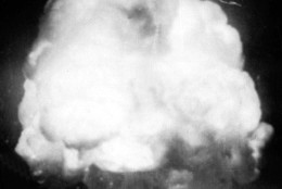 The first U.S. atom bomb explodes during a test in Alamogordo, N.M., July 16, 1945.  The cloud went 40,000 feet in the air, as viewed by an automatic camera six miles away from the site.  (AP Photo)