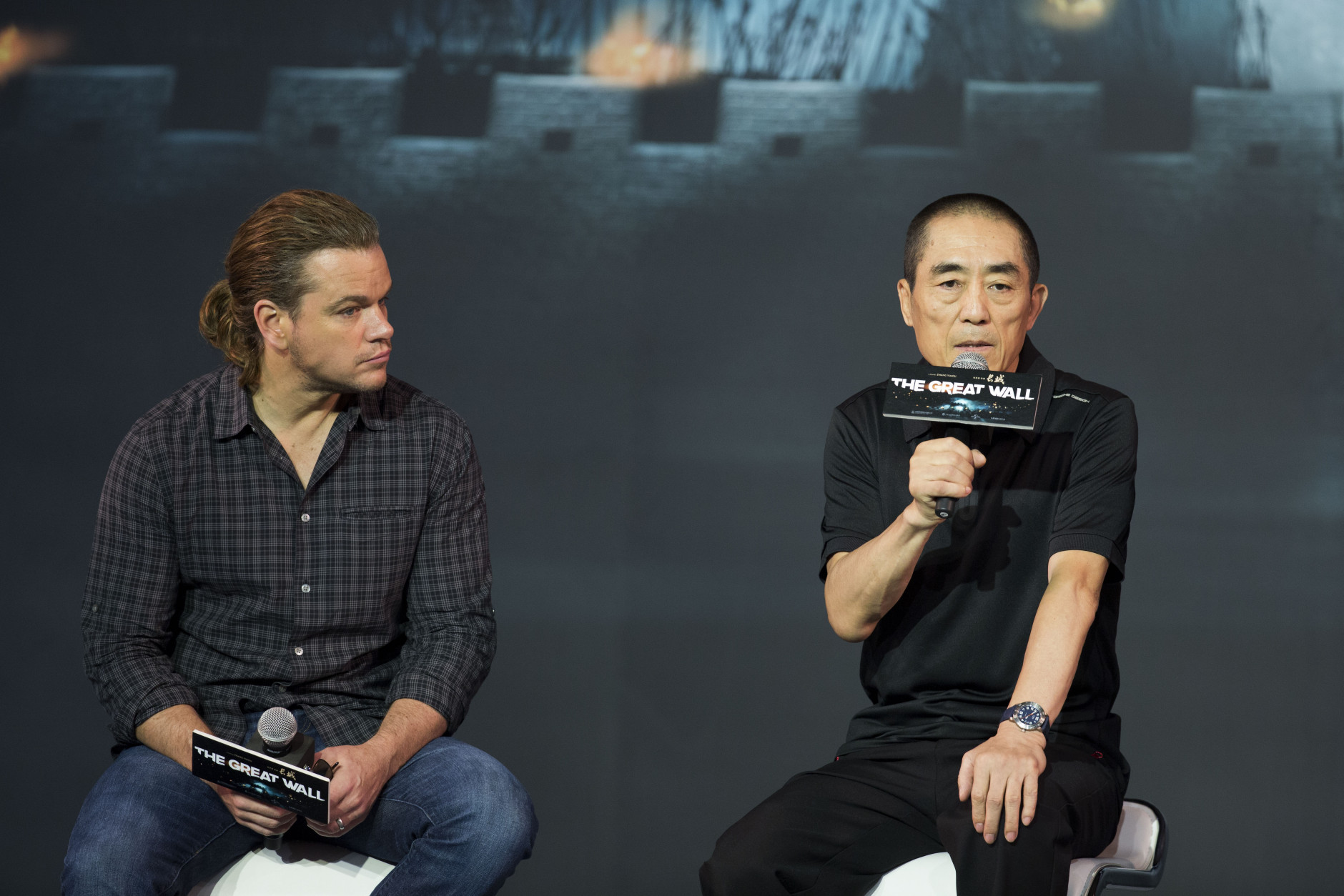 Movie director Zhang Yimou, right, speaks next to actor Matt Damon during a press conference of their latest movie The Great Wall held at a hotel in Beijing, China, Thursday, July 2, 2015.  (AP Photo/Andy Wong)