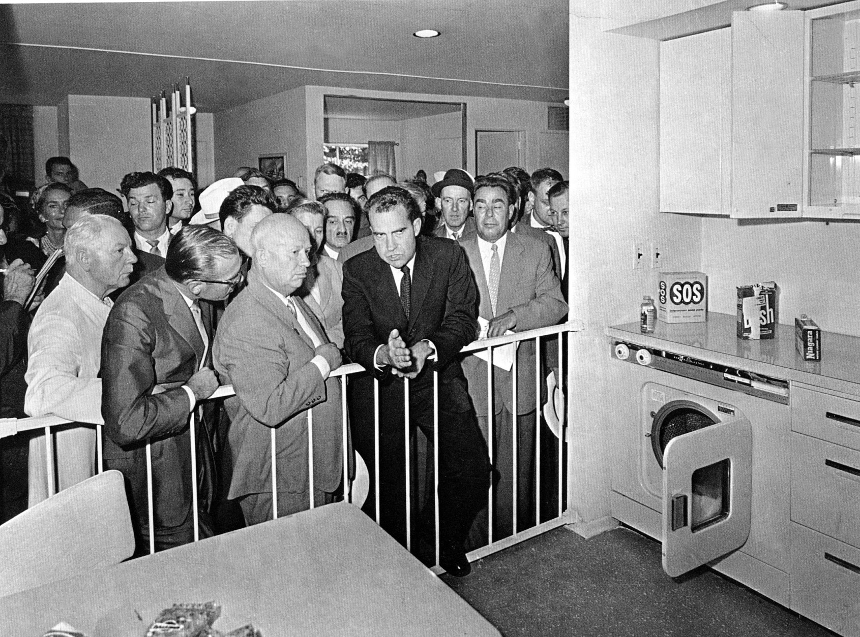 Soviet Premier Nikita Khrushchev, center left, talks with U.S. Vice President Richard Nixon during their famous "Kitchen Debate" at the United States exhibit at Moscow's Sokolniki Park, July 24, 1959.  While touring the exhibit, both men kept a running debate on the merits of their respective countries. Standing to the right is Khrushchev's deputy, Leonid Brezhnev.  (AP Photo)