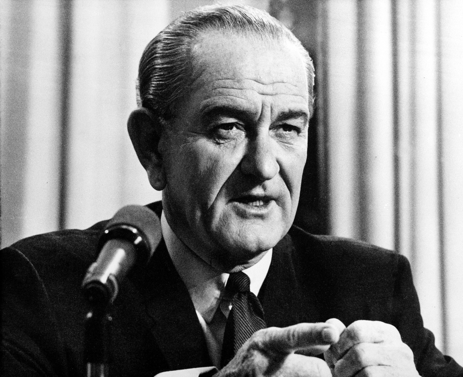 On this date in 1965, President Lyndon B. Johnson announced he was increasing the number of American troops in South Vietnam from 75,000 to 125,000 "almost immediately." Here,  Johnson addresses the nation in a radio and television broadcast from his desk at the White House in Washington, D.C., on March 31, 1968.   In his speech the president talked about plans to de-escalate the war in North Vietnam and his plans not to run for re-election.  (AP Photo)