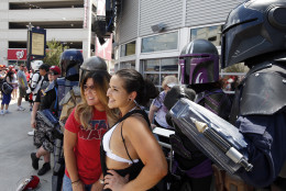 Fans pose with Star Wars characters on Star Wars day before a baseball game between the Washington Nationals and the Los Angeles Dodgers at Nationals Park, Sunday, July 19, 2015, in Washington. (AP Photo/Alex Brandon)