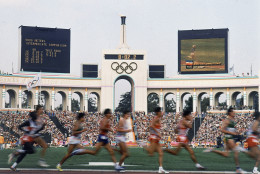 On this date in 1984, the Los Angeles Summer Olympics opened. This Aug. 11, 1984, file photo shows a field of entrants during the Men's 5,000 meter event at the Summer Olympic Games in Los Angeles. (AP Photo, File)