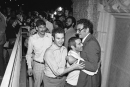 In 1977, a jury in Washington D.C. convicted 12 Hanafi (hah-NAH’-fee) Muslims of charges stemming from the hostage siege at three buildings the previous March. Hostages are seen here were released armed terrorists in three Washington buildings. They arrive at the Foundry Methodist Church in Washington on Friday, March 11, 1977 following their release. Some 134 hostages were released by the gunmen unharmed after a three-hour negotiating session with police officials and ambassadors from three Islamic nations. (AP Photo)