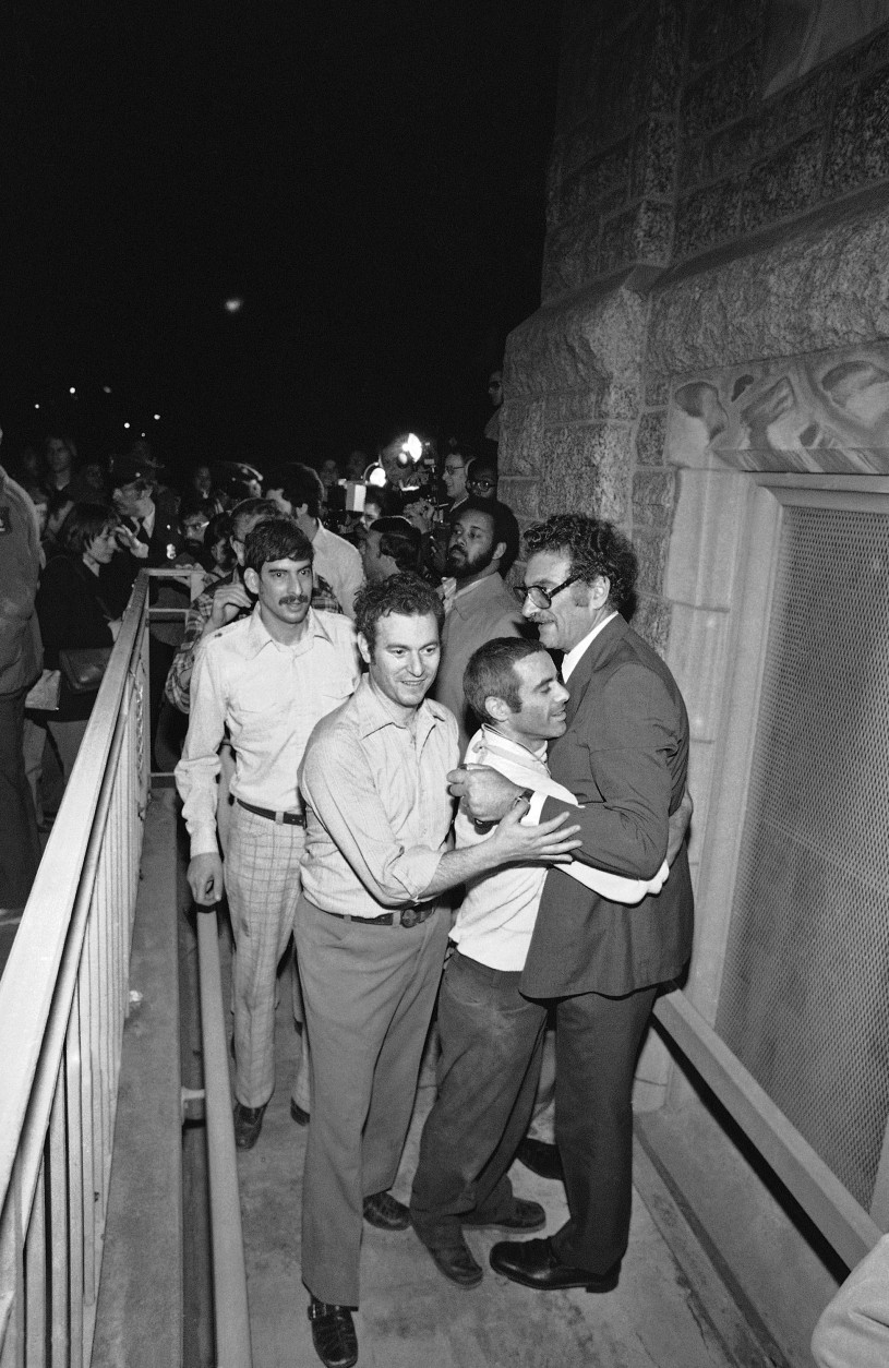 In 1977, a jury in Washington D.C. convicted 12 Hanafi (hah-NAH’-fee) Muslims of charges stemming from the hostage siege at three buildings the previous March. Hostages are seen here were released armed terrorists in three Washington buildings. They arrive at the Foundry Methodist Church in Washington on Friday, March 11, 1977 following their release. Some 134 hostages were released by the gunmen unharmed after a three-hour negotiating session with police officials and ambassadors from three Islamic nations. (AP Photo)